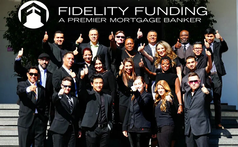 The Fidelity Funding team giving a thumbs up on the office steps